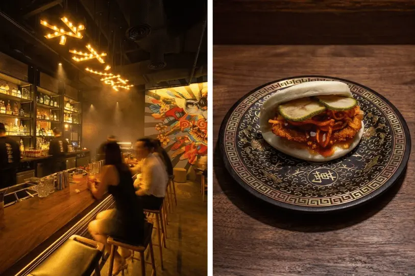 A split image featuring a contemporary, atmospheric izakaya bar with neon lighting and patrons on the left, and a close-up of a crispy meat katsu bao bun resting on an ornate black and gold patterned plate on the right.