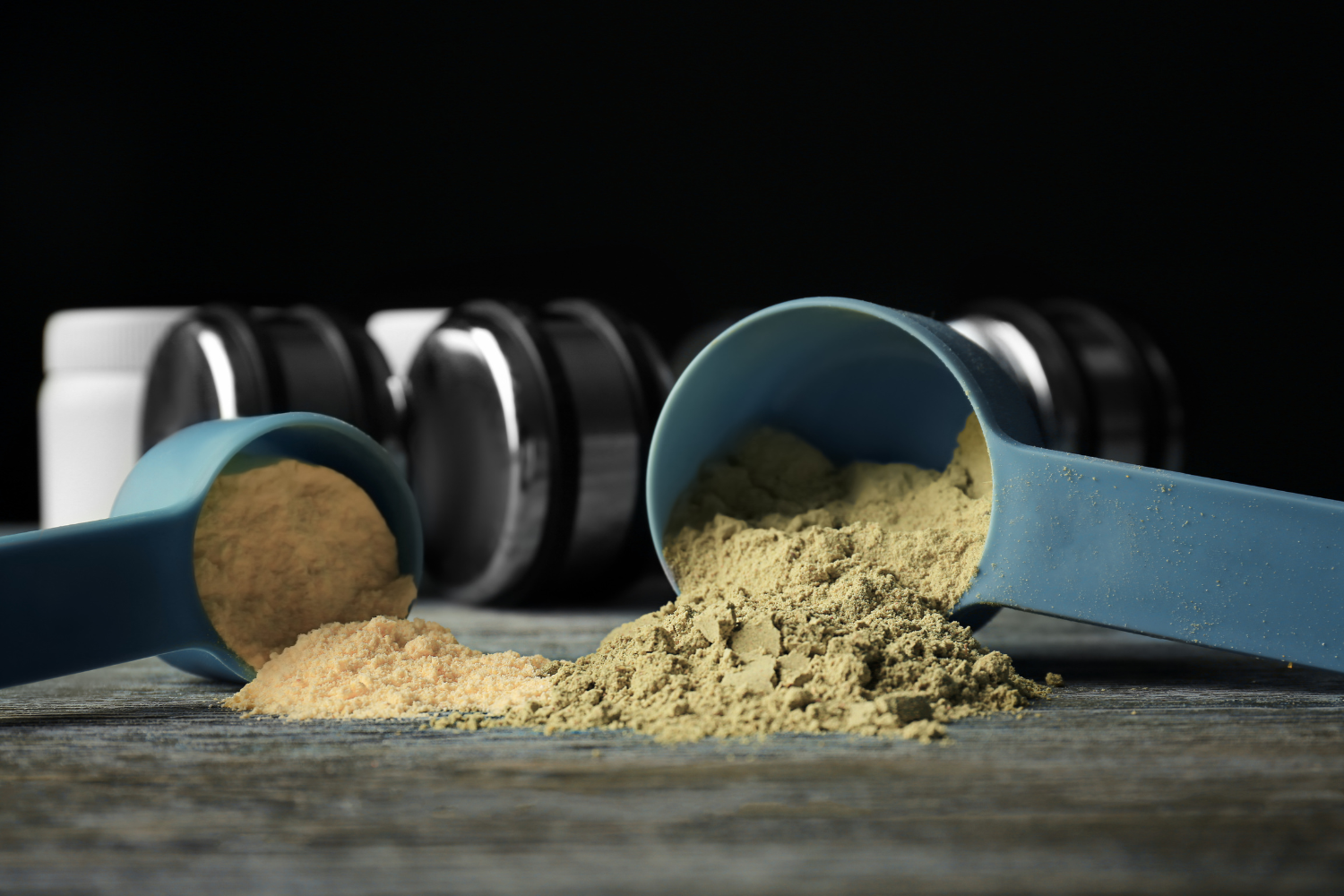 Several measuring cups of protein powder.