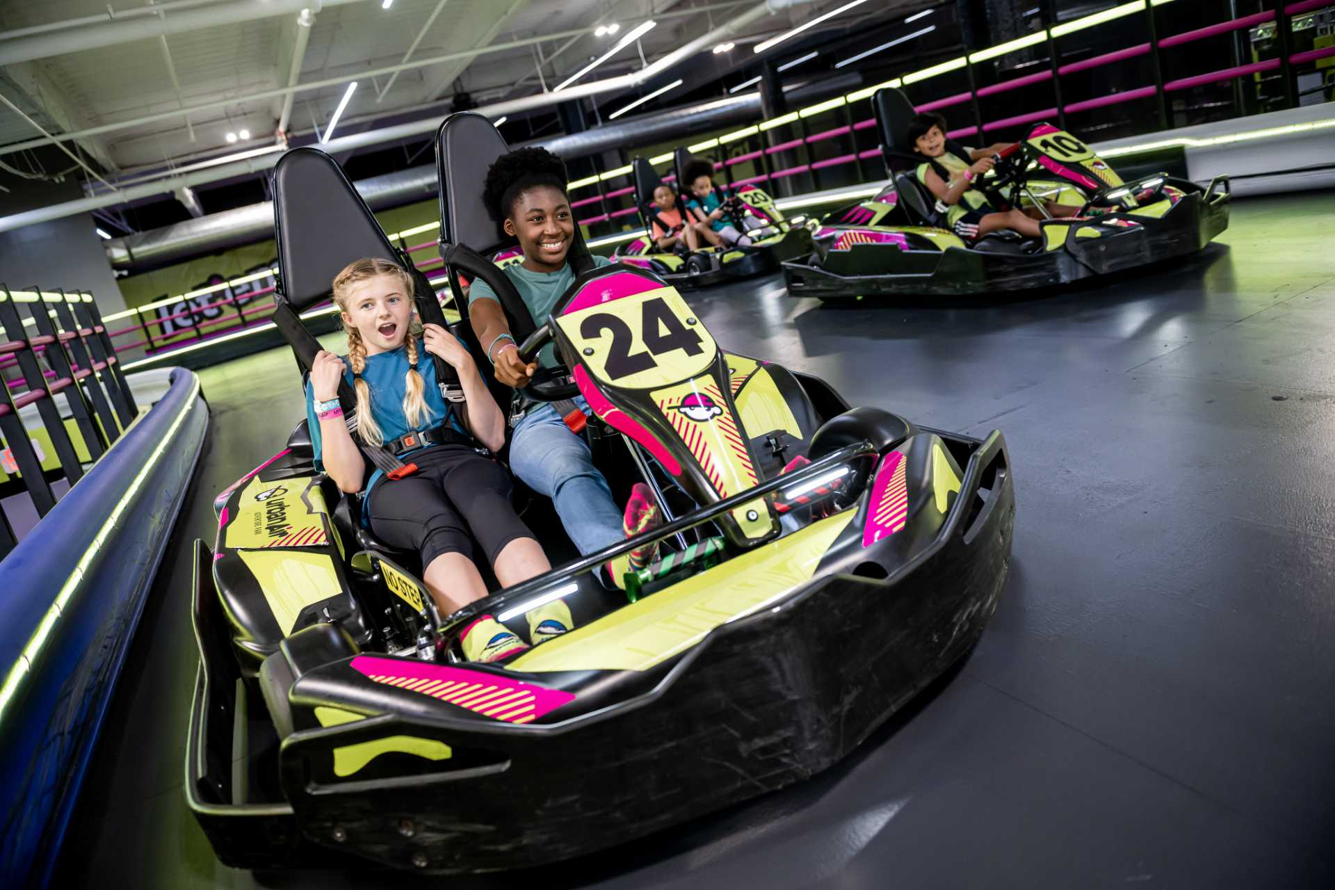 kids enjoy go-kart rides as part of the ultimate birthday party bundle