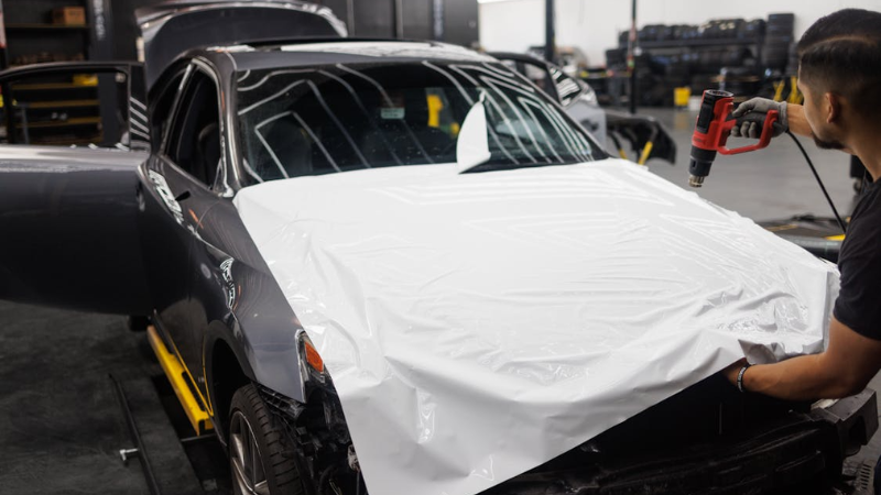 a mechanic giving Brushed aluminium appearance with heat gun