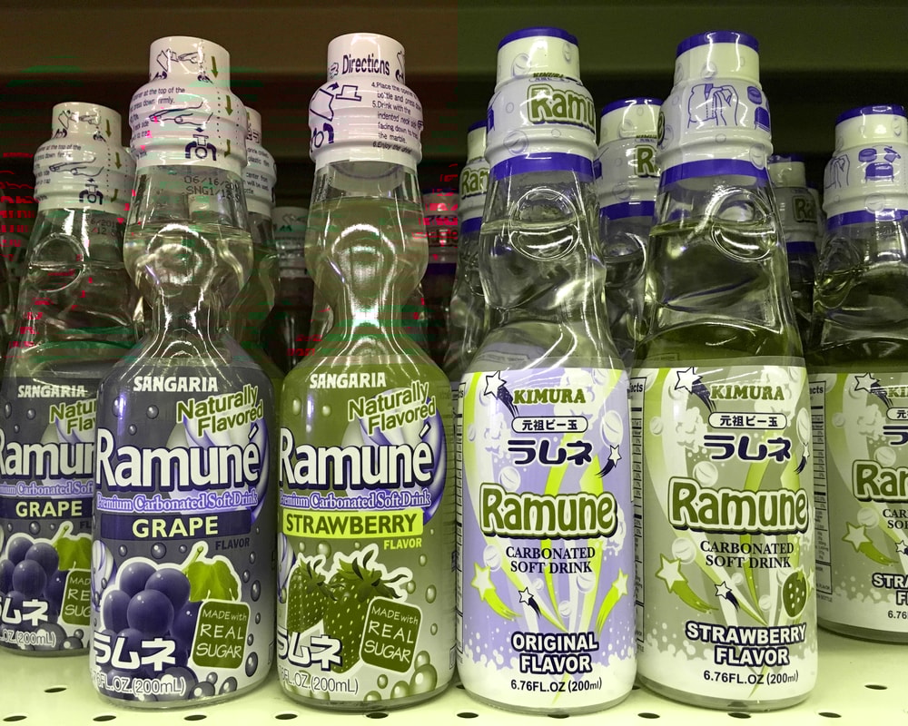 Alameda, CA - October 28, 2017 Grocery store shelf with bottles of Ramune sodas. Originally created and sold in Japan the name is derived from the English word lemonade translated into Japanese.
