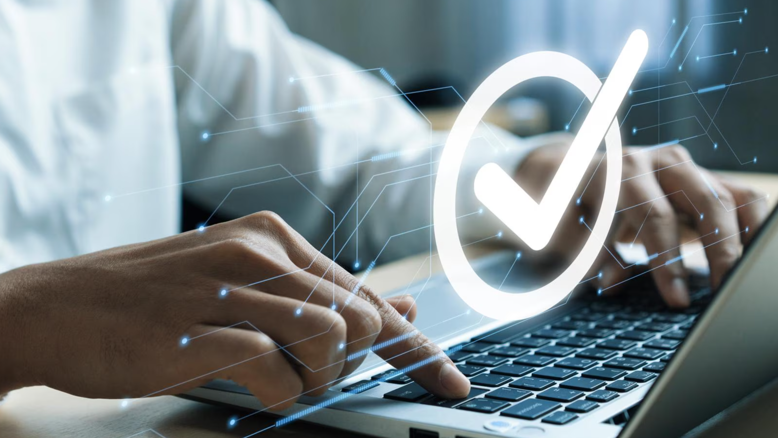 Person typing on a laptop with a digital checkmark overlay, emphasizing the need for high speed Ethernet connections, network security, and consistent download speeds.