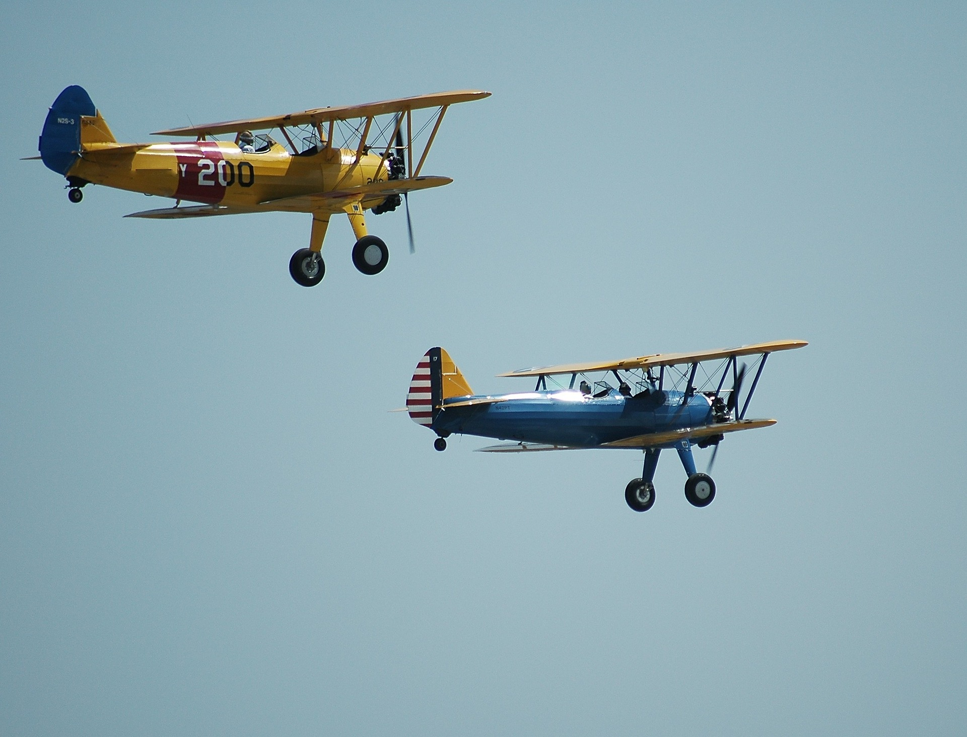 Two planes flying in an air show. 