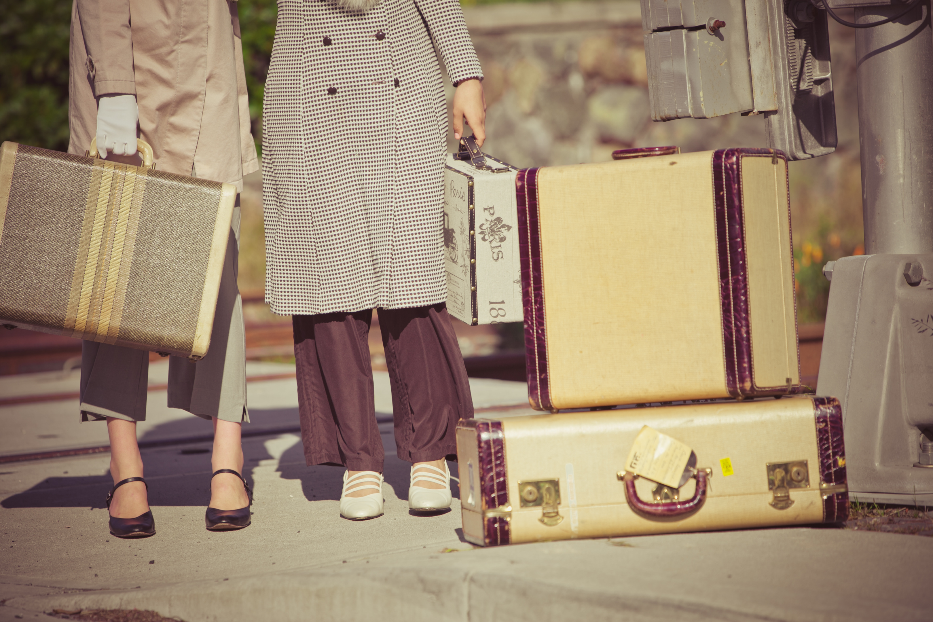 https://elements.envato.com/two-young-women-holding-their-vintage-suitcases-MFV58A6