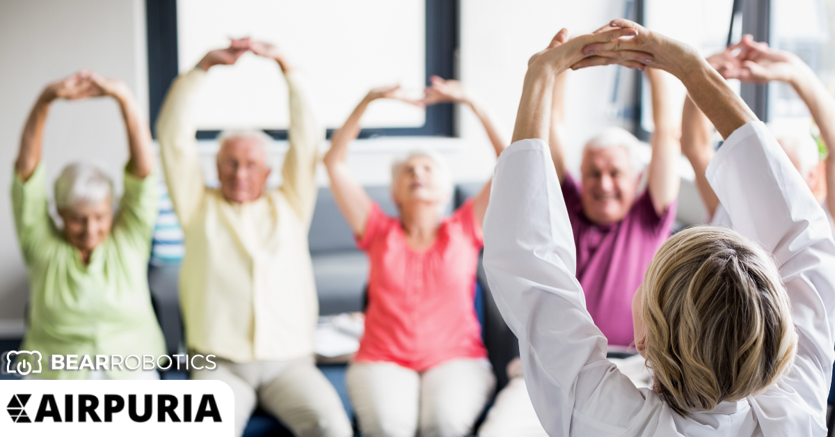 Image of a group of retirees benefiting from the use of Servi, ranked better than the pepper robot from Softbank on all review forms submitted.