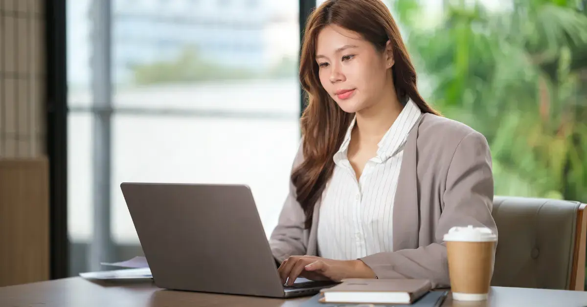 Woman reviewing Form 433-F paperwork and OnlyFans income records for IRS tax debt planning.