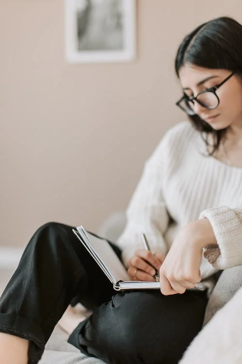 Woman on couch updating estate plan