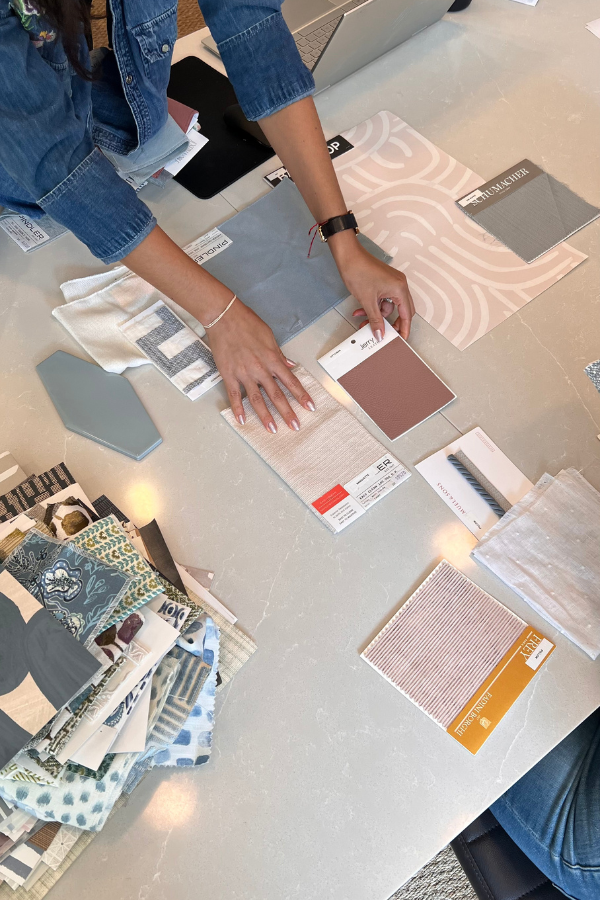 an interior designer arranging samples