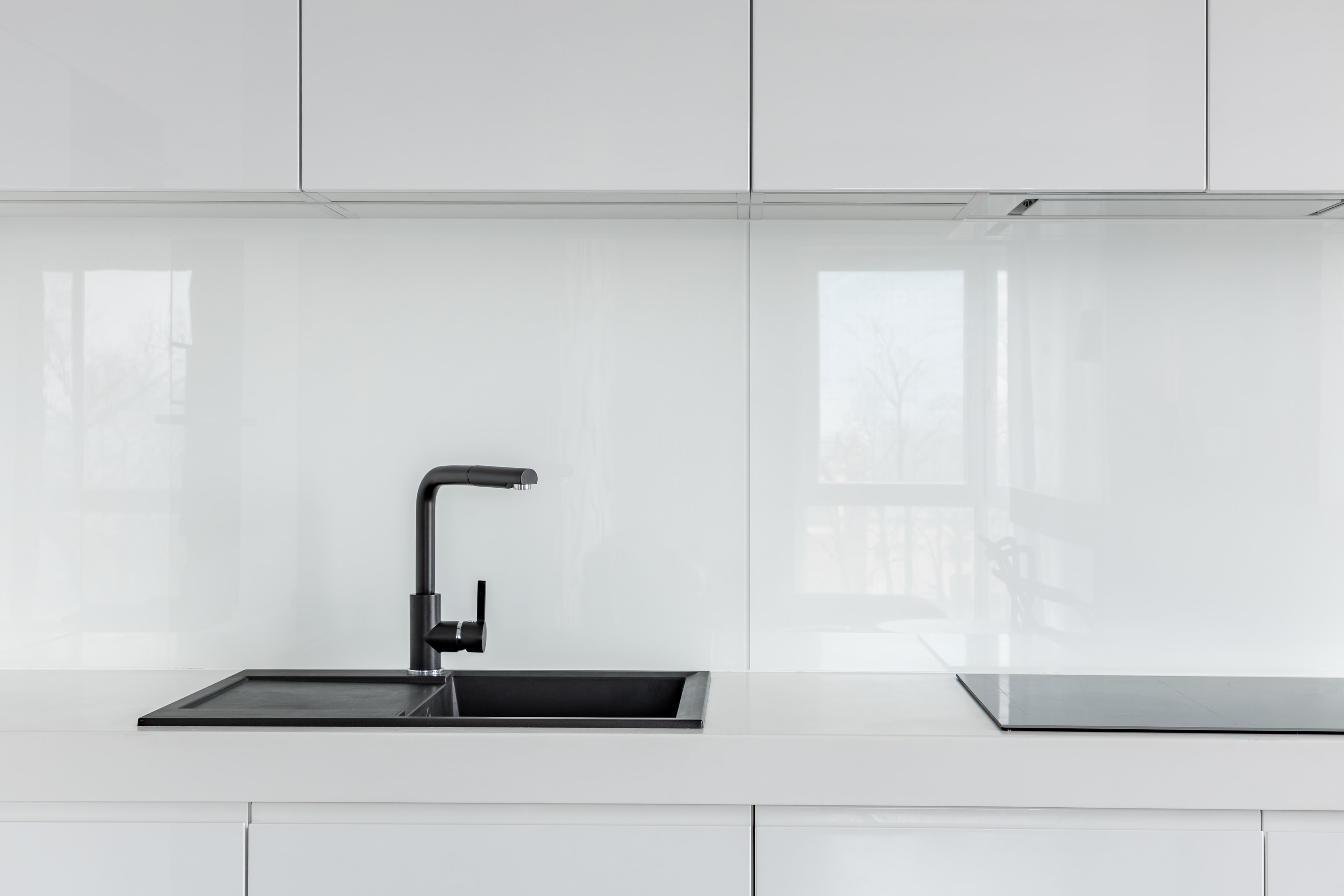 White kitchen units and backsplash
