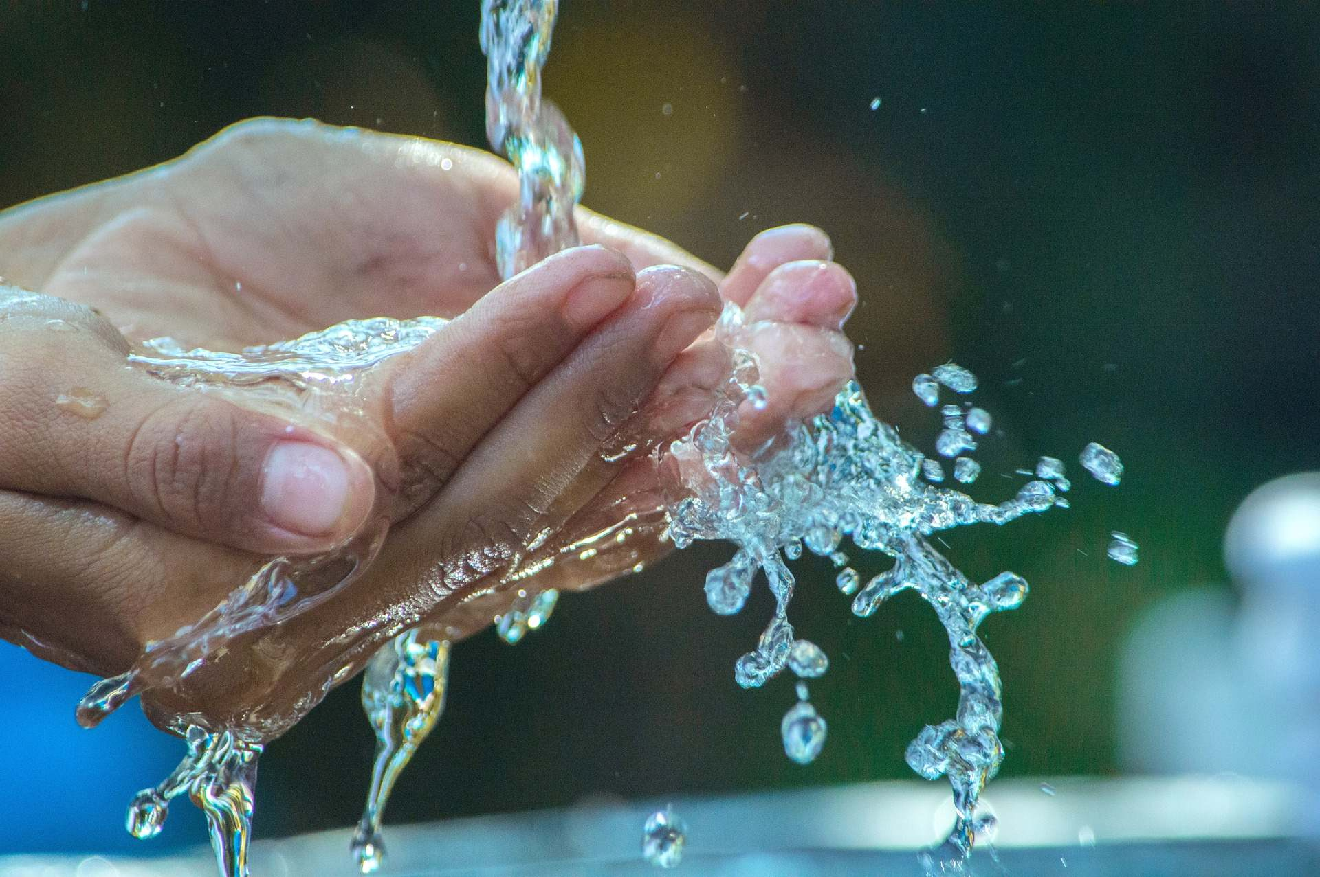 Water flows into hands