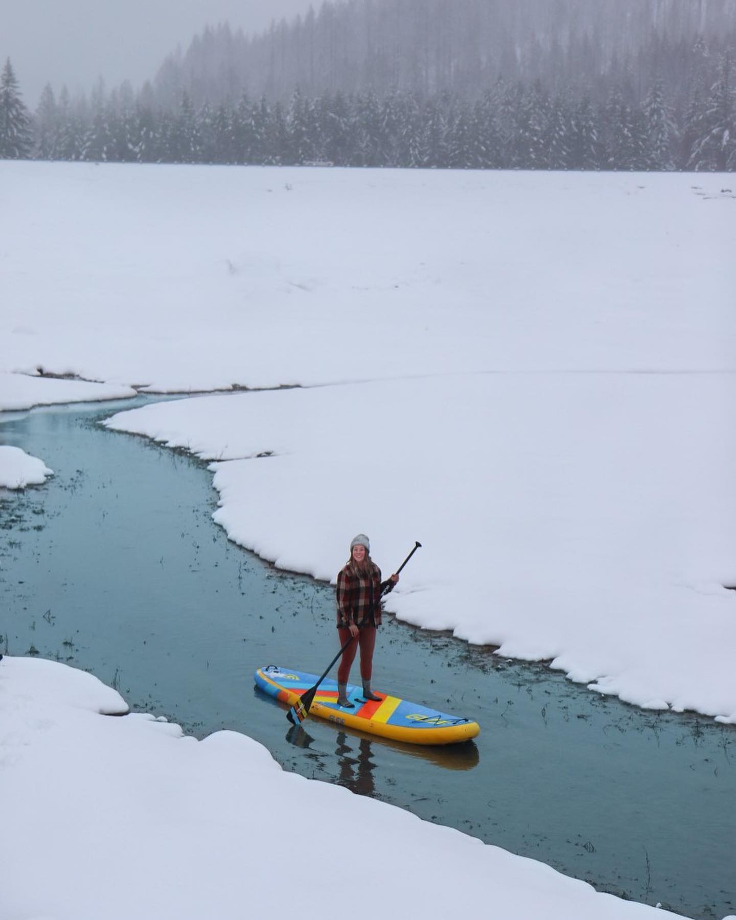 inflatable paddle board in the snow