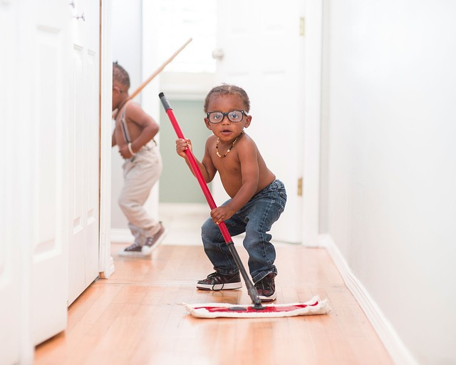 young boy mopping floor