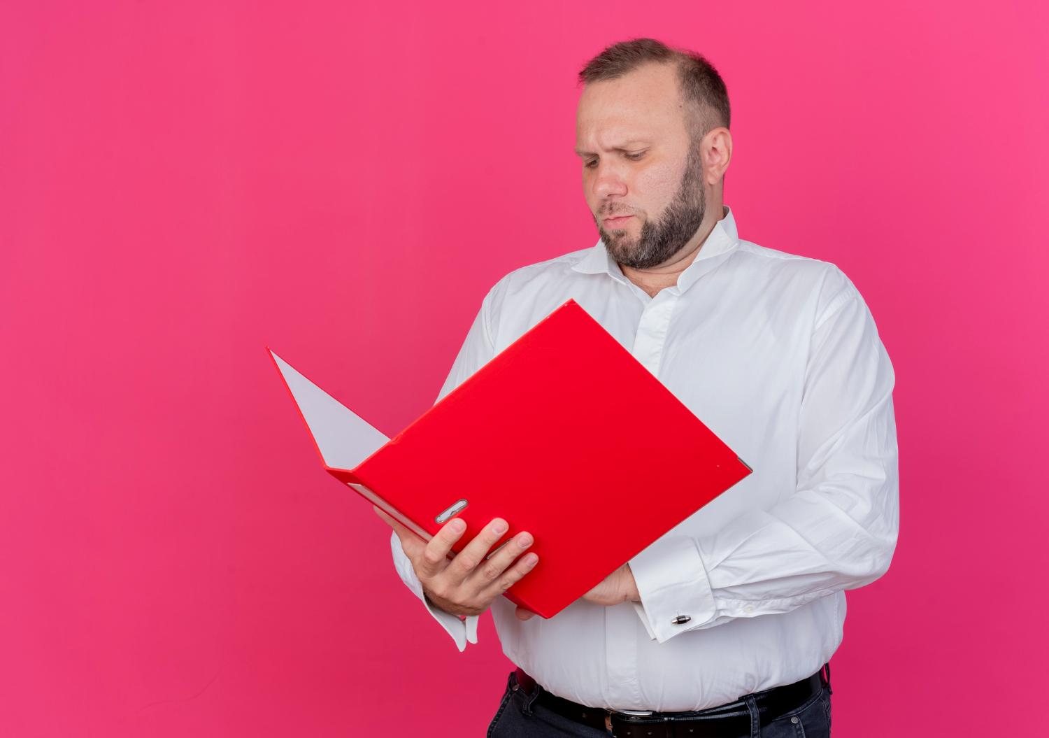 Man checking the competitor's catalog.