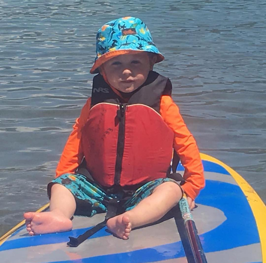 young child on a paddle board