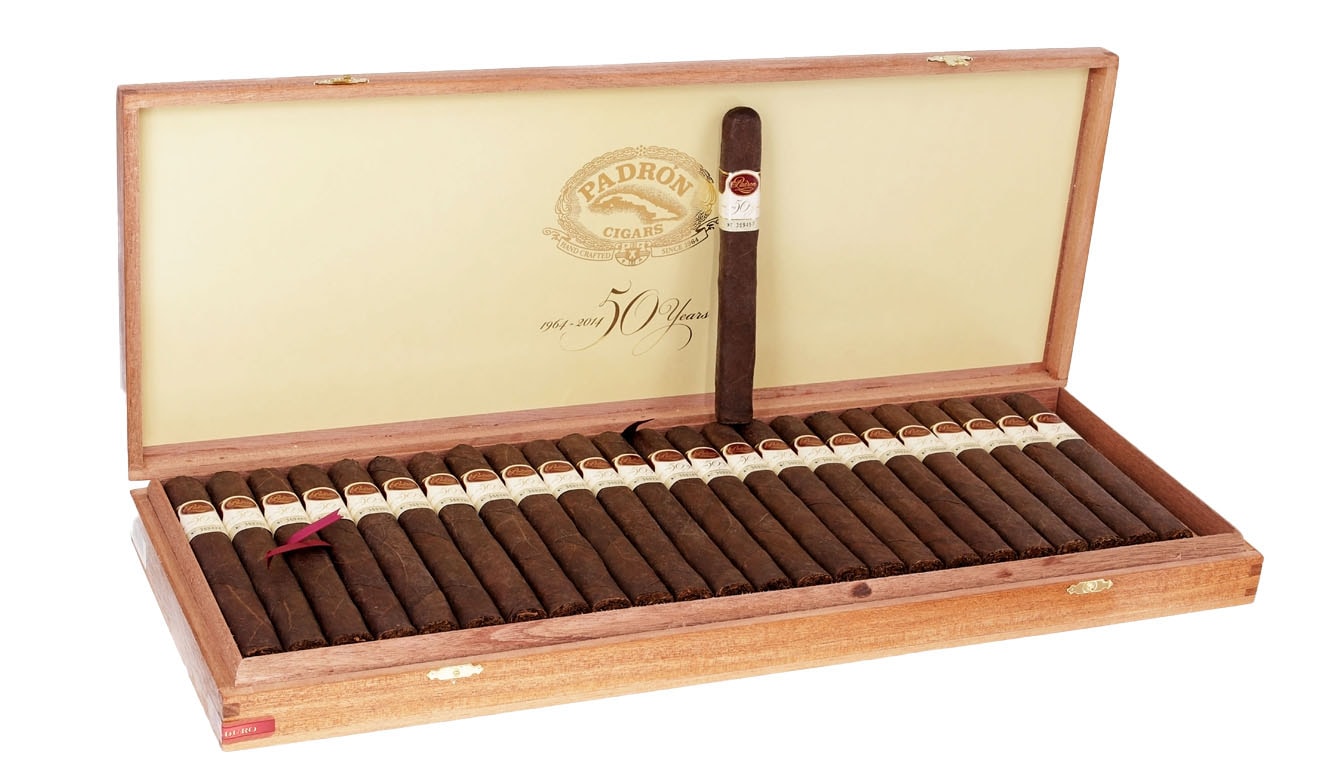 A close-up view showcases luxury cigars adorned with gold accents and crystal decorations, highlighting their exceptional craftsmanship and rarity. These limited edition cigars promise a refined smoking experience, appealing to cigar enthusiasts who appreciate the rich flavors and unique blends found in the world of rare cigars.