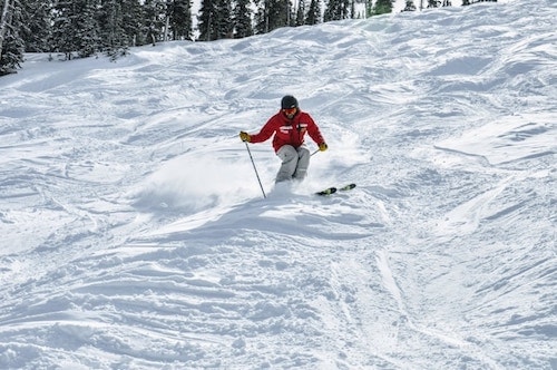 Downhill skier going down moguls at Mohawk Mountain