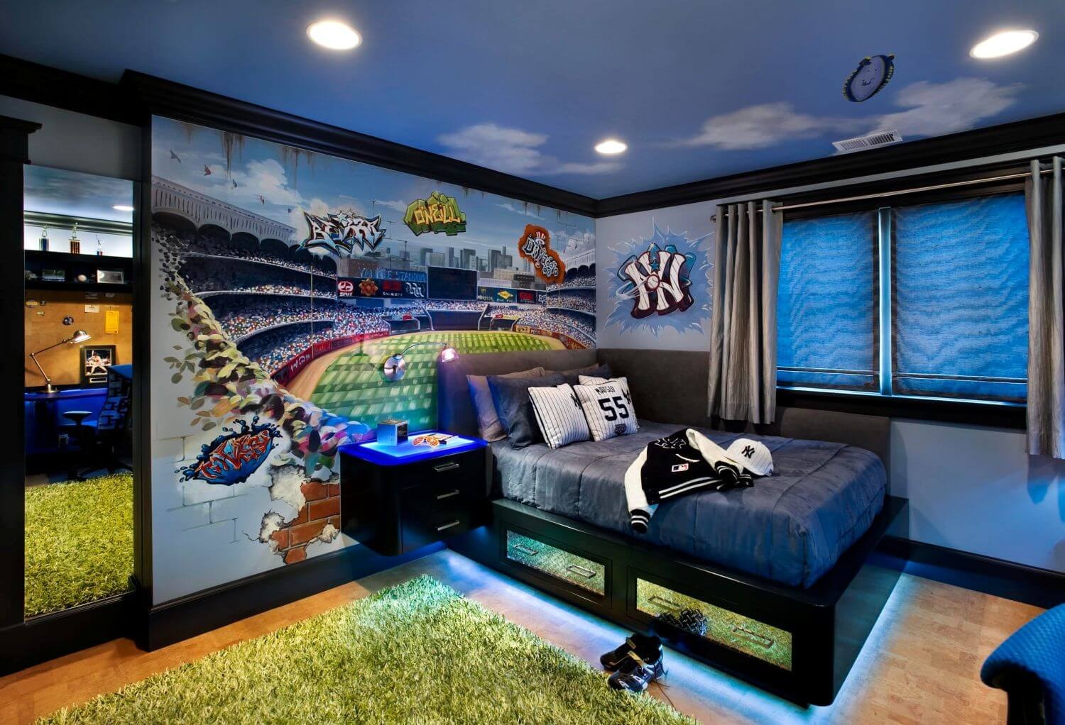 boy bedroom with sports theme and blue led lights underneath the bed for illumination