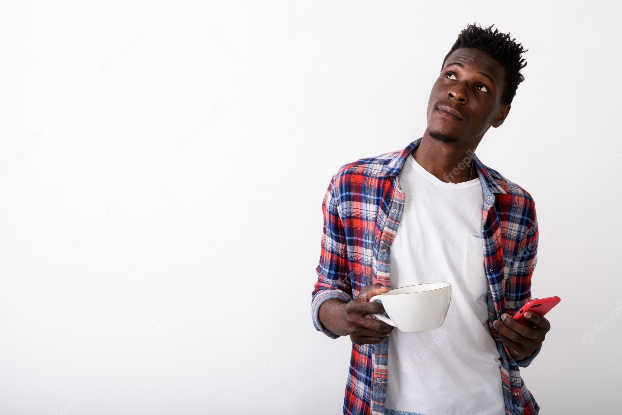 Man Thinking With Cup and Phone In Hand