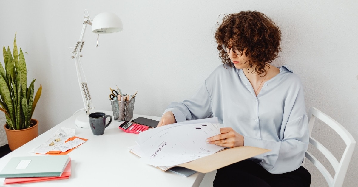 A woman filing taxes related to the 1099-MISC tax percentage.