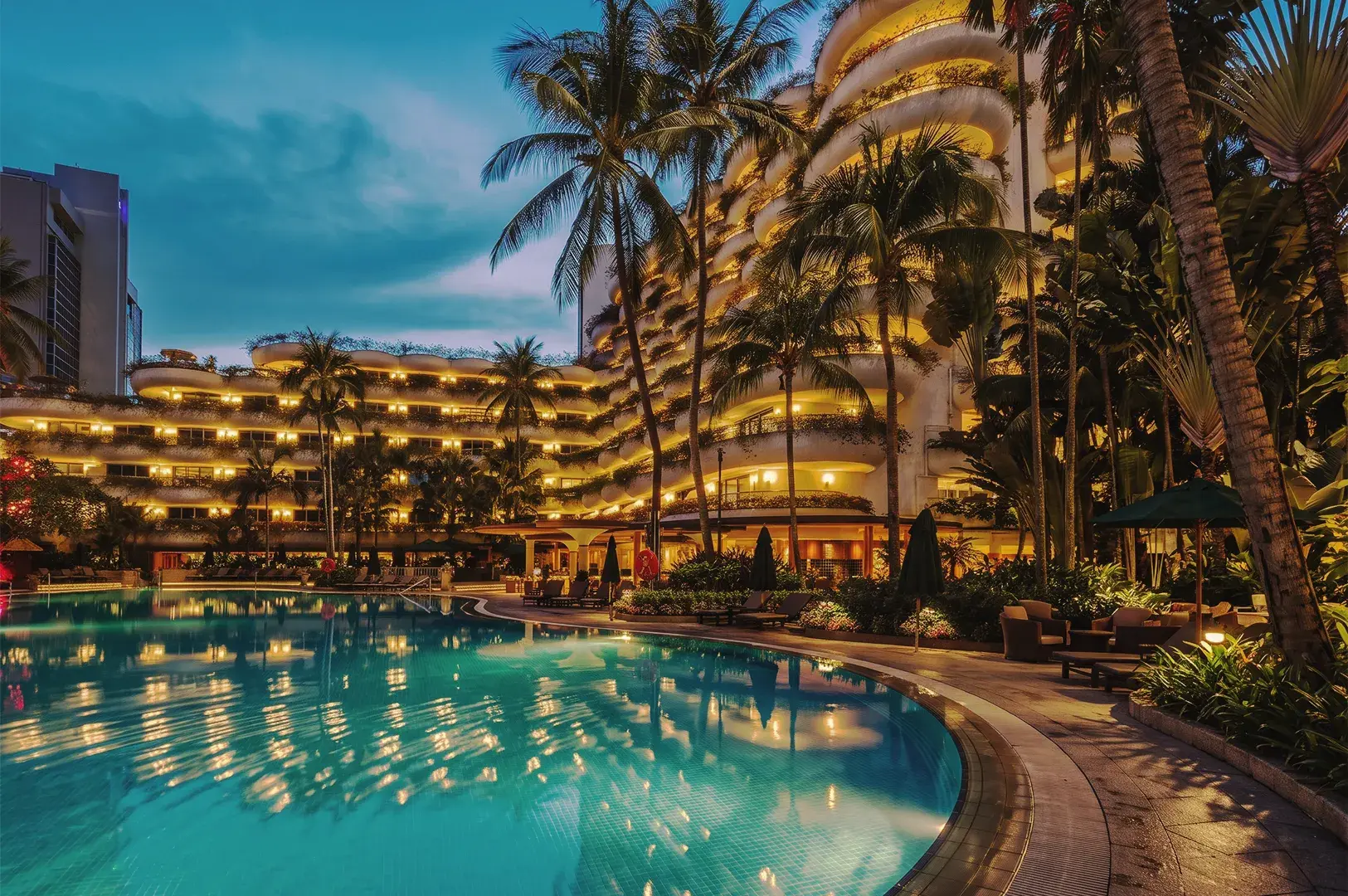 Bright luxury hotel room with balcony, tropical palm tree views, contemporary furnishings, and premium guest amenities
