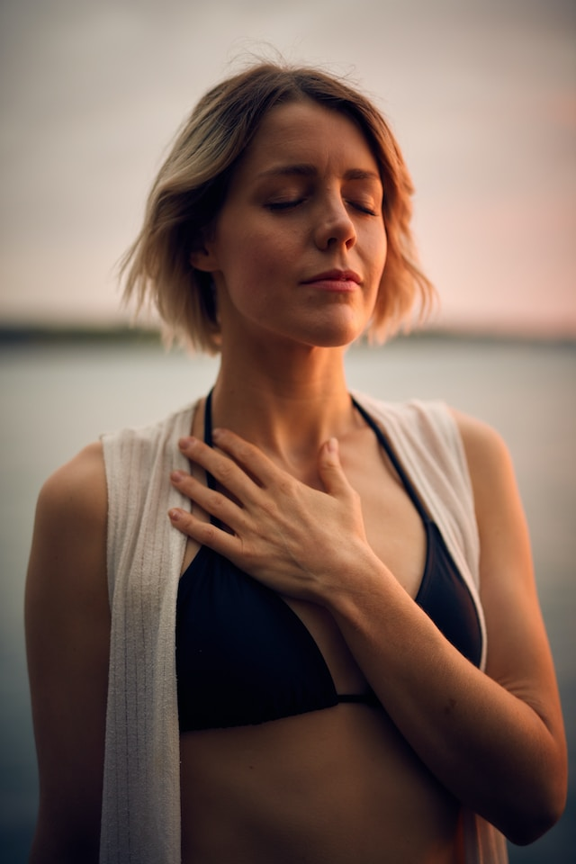 A way to protect your energy - a woman taking deep breaths. Photo by <a href="https://unsplash.com/@dariusbashar?utm_source=unsplash&utm_medium=referral&utm_content=creditCopyText">Darius Bashar</a> on <a href="https://unsplash.com/photos/xMNel_otvWs?utm_source=unsplash&utm_medium=referral&utm_content=creditCopyText">Unsplash</a> 