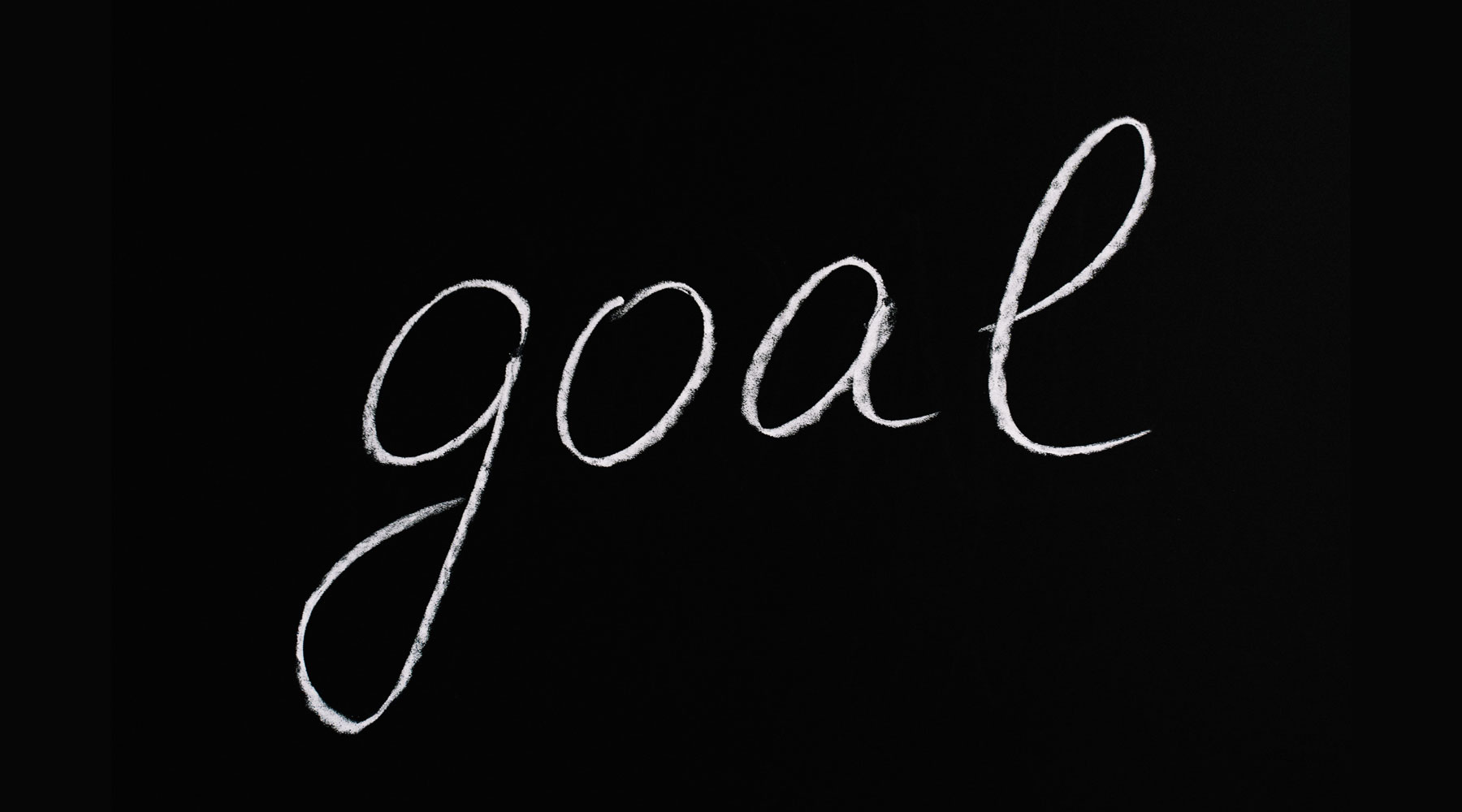 The word 'goal' written in chalk