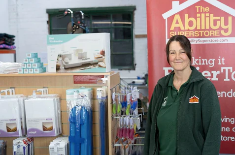 Picture shows Carol (one of the staff that works at Ability Superstore) standing in the Ability Superstore shop