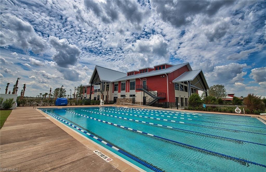 The image features modern energy-efficient homes in Babcock Ranch, showcasing sustainable design elements such as solar panels and eco-friendly materials. This innovative community in Southwest Florida emphasizes renewable energy and offers a harmonious blend of nature and modern living for its residents.