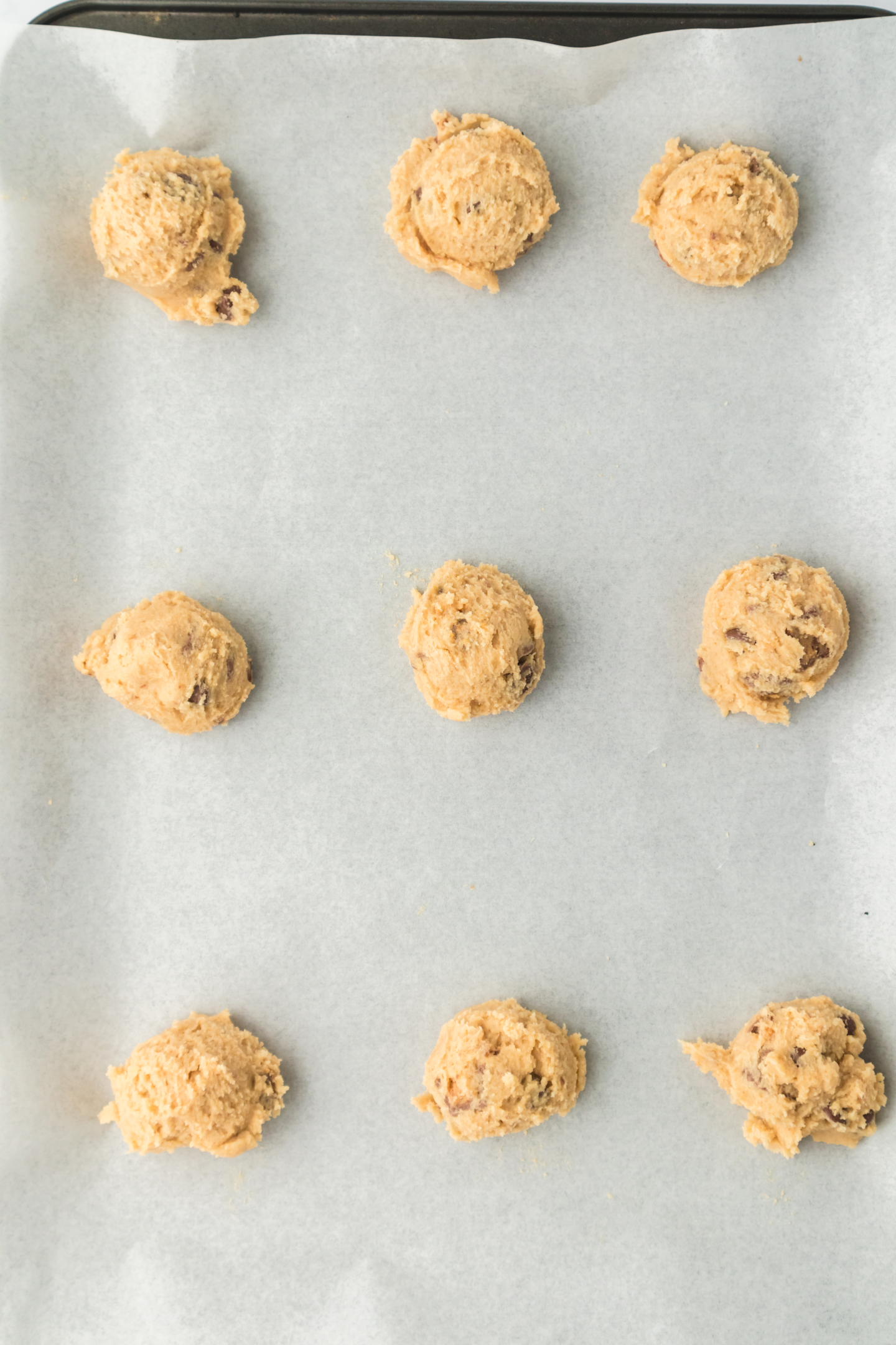 peanut butter cup cookie dough scooped and placed onto baking sheet