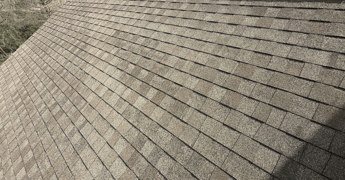 Overhead view of asphalt roof in good condition, showing how proper ventilation and heat-resistant materials can extend roof life.
