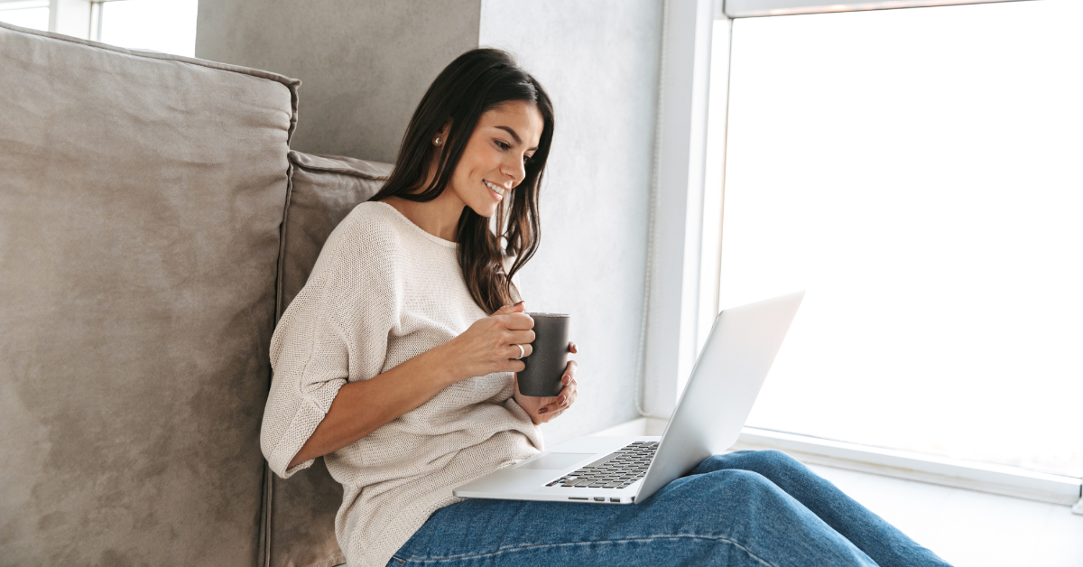 Woman exploring OnlyFans free trial options on her laptop while managing her account.
