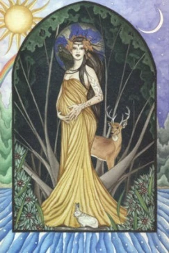 Danu is draped in a yellow dress in an arch way that leads to outside. There is a deer and trees behind her. Outside of the archway is a sun to her left and a moon to her right.