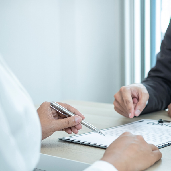 An image showing a lawyer discussing a Georgia truck accident case with a client.