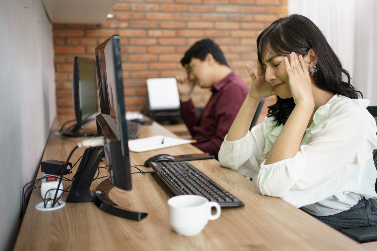 Filipino remote workers looking frustrated during a brownout.