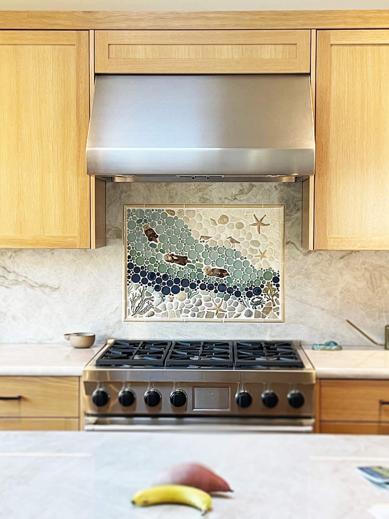 sea otters add whimsy to this kitchen backsplash