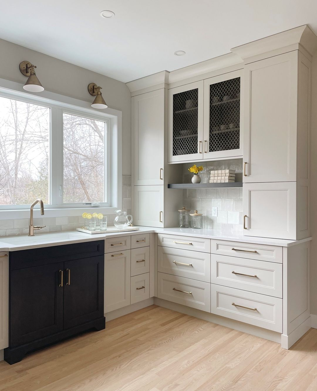 cream cabinets with black accent cabinet