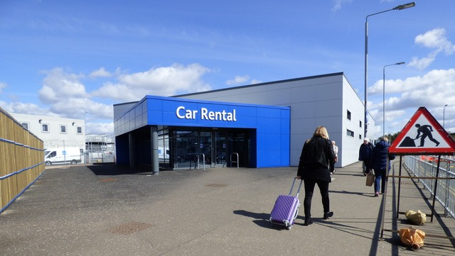 Building with car rental sign