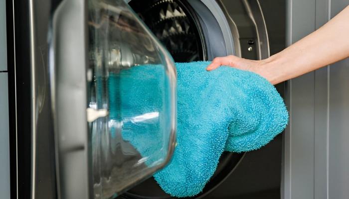 A microfiber towel is being washed to assess its performance