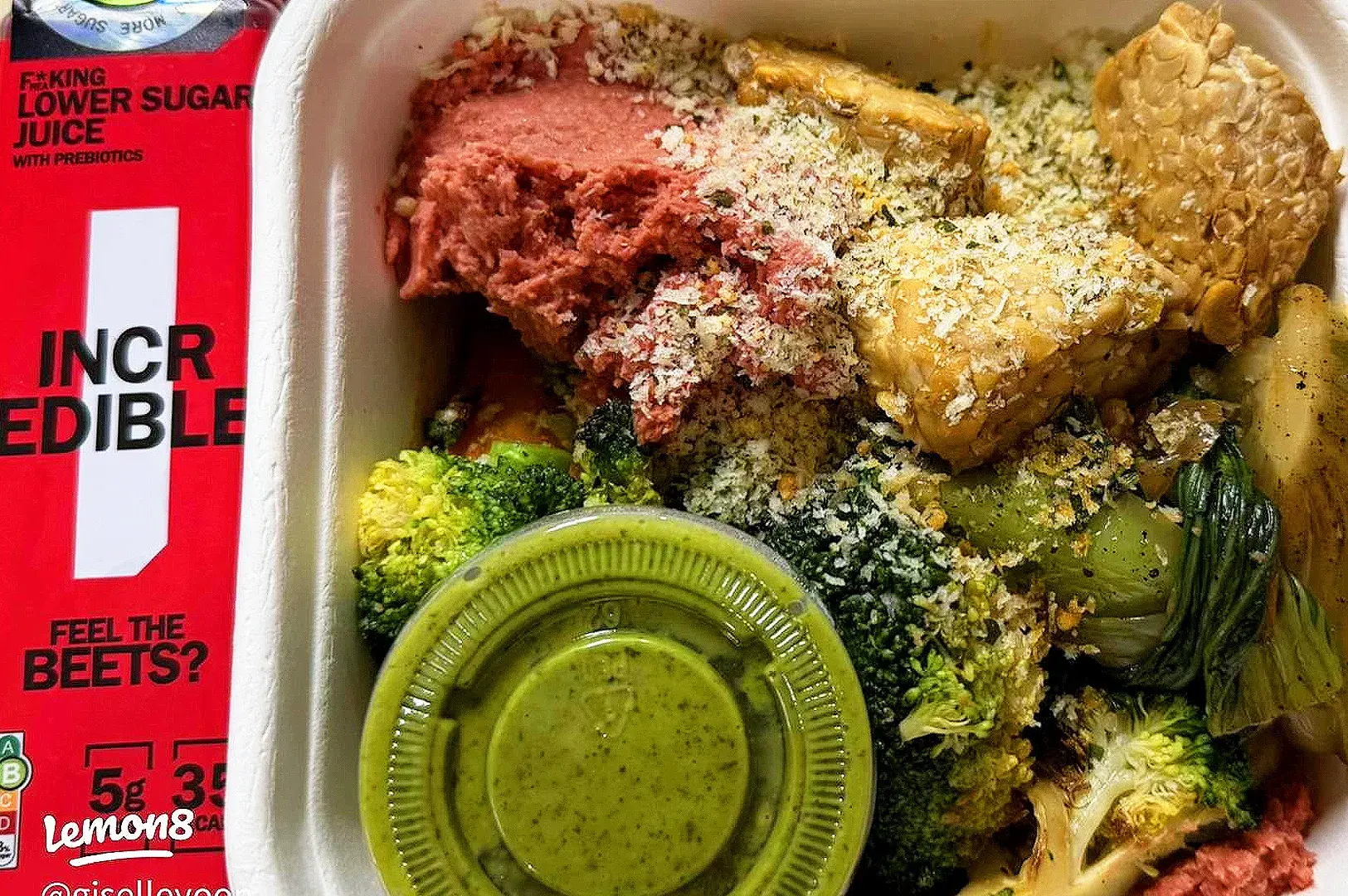 Healthy meal box from The Daily Cut Singapore with grilled chicken, roast vegetables, beetroot, broccoli, and green sauce.