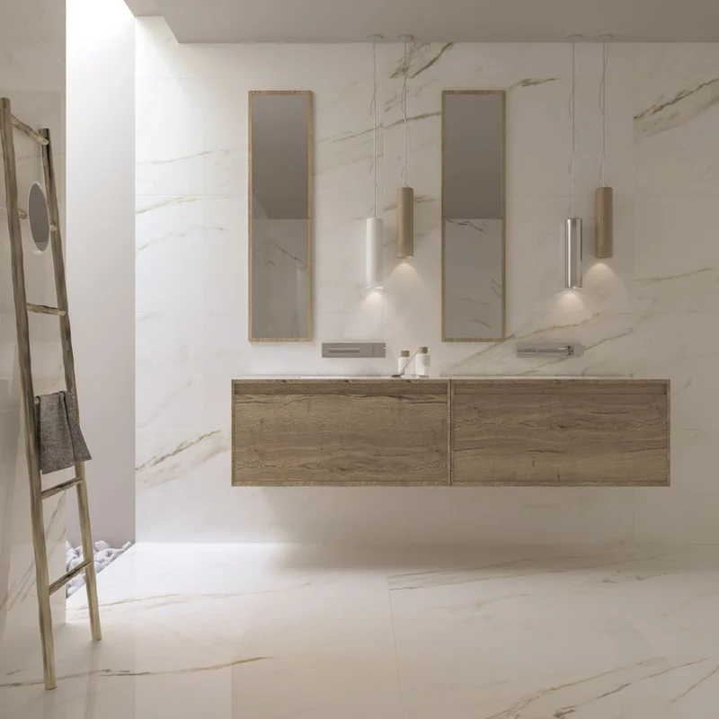 Sleek modern bathroom with XL-format marble tiles, a floating wood vanity, and minimalist floating mirrors for a clean, spacious look.