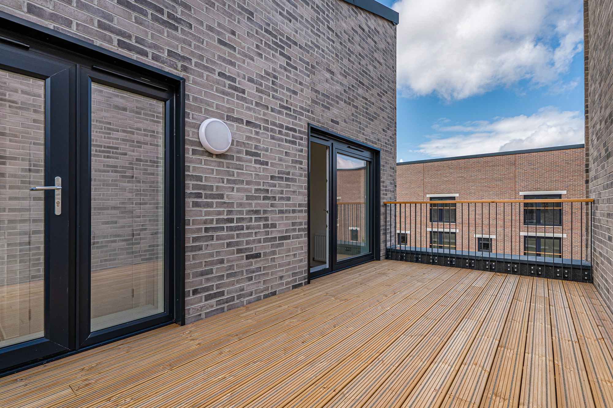 new build homes with large nine foot open space roof terrace in Glasgow housing development 