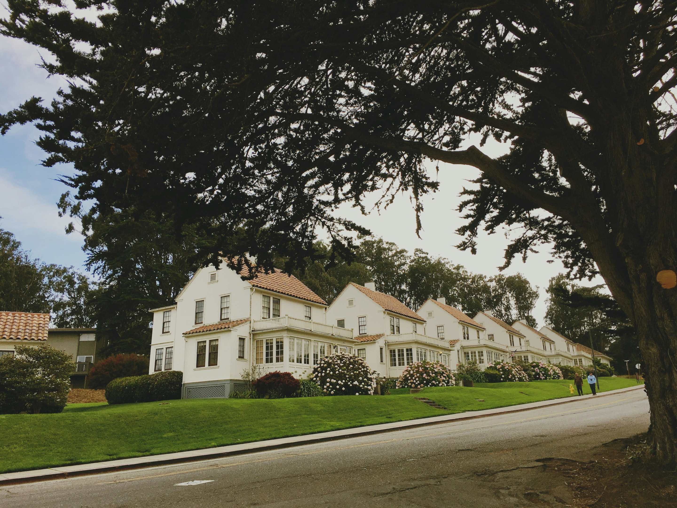 Row of houses in city, including one owned by a motivated seller working with real estate investor.