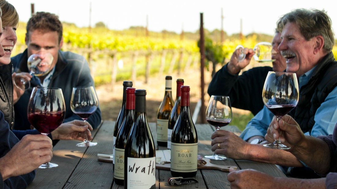 Group of winemakers enjoying the fruits of their labor