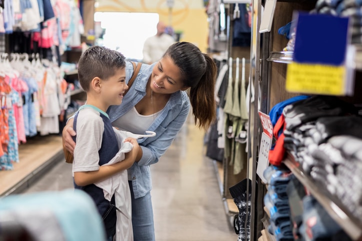 Young mom and son shopping. 