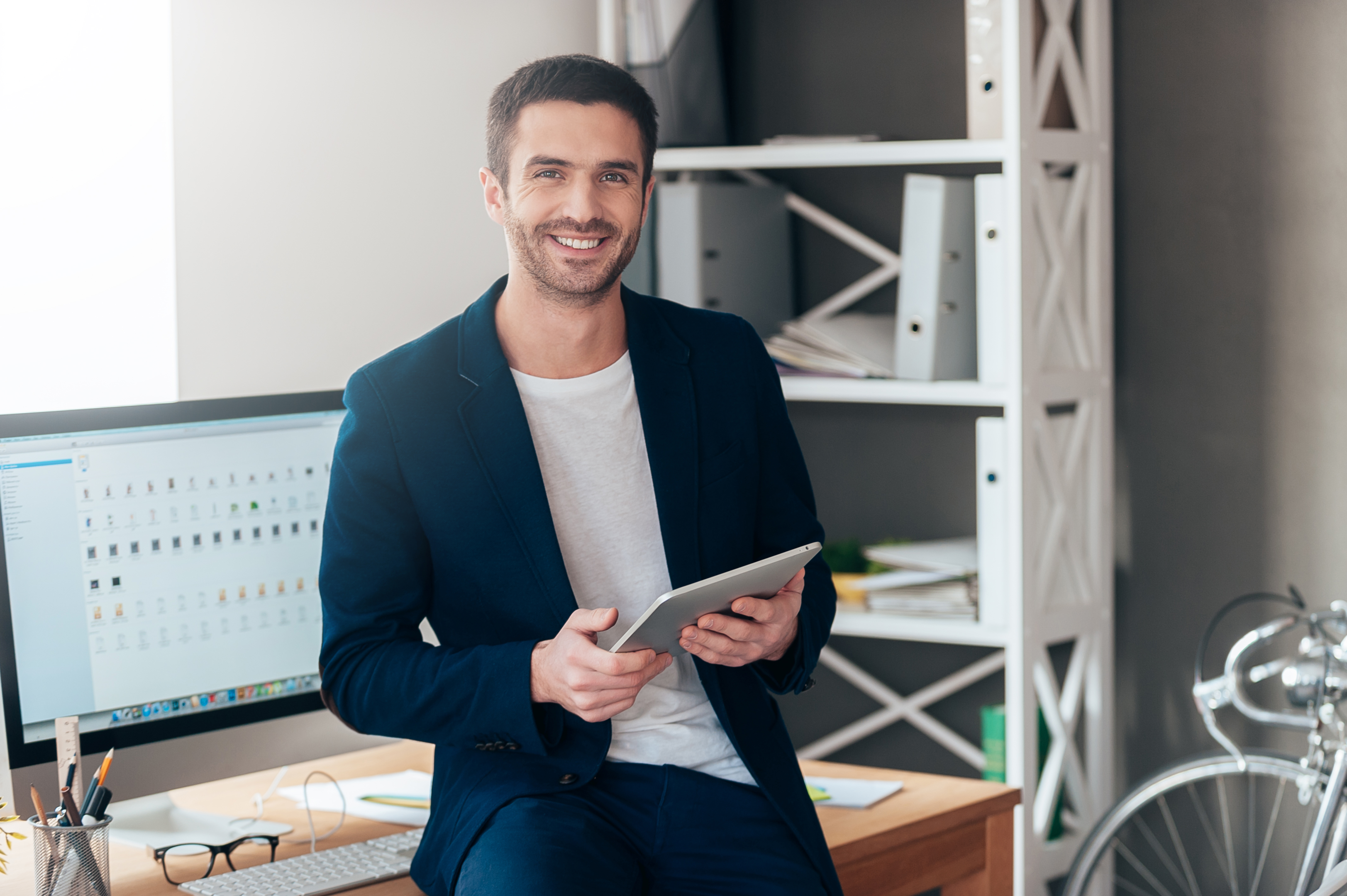 Professional man holding tablet