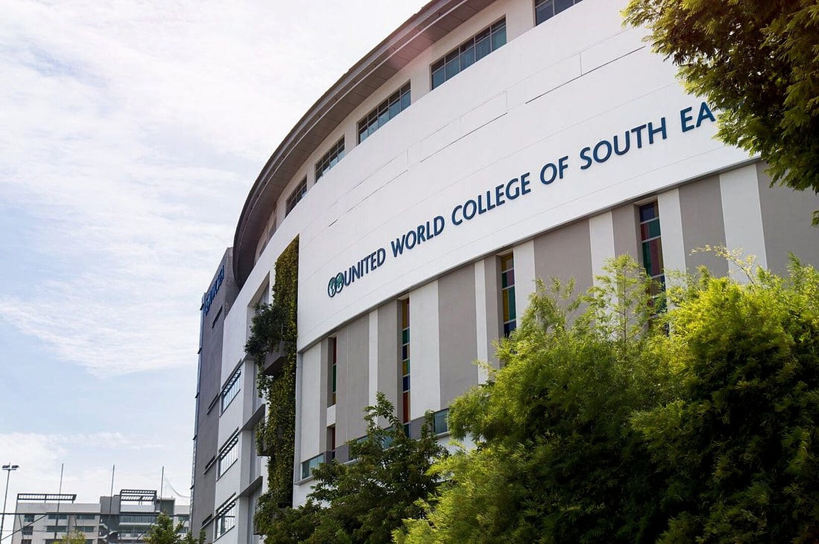 United World College of South East Asia campus in Singapore, showcasing modern architecture and lush greenery.