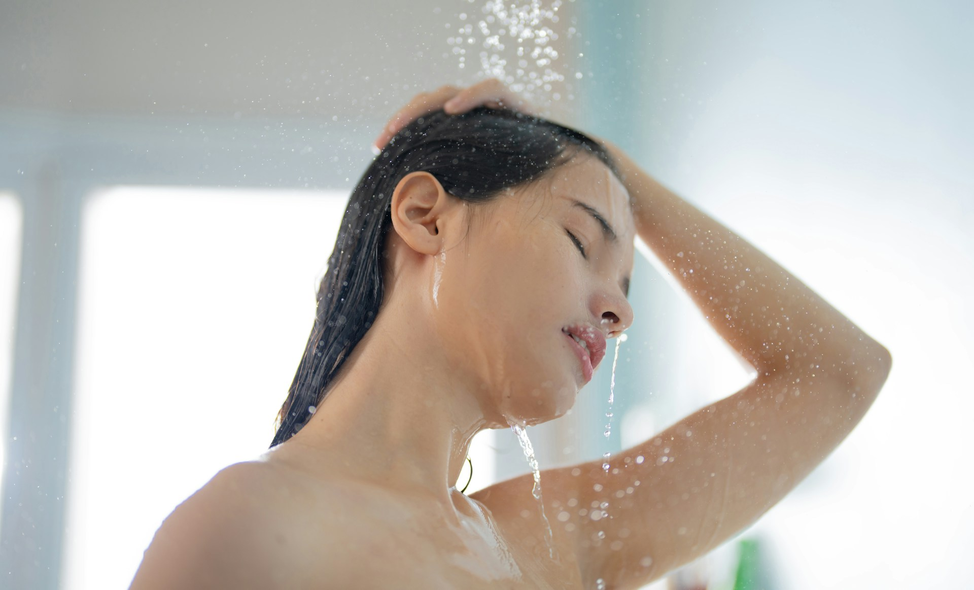 https://unsplash.com/photos/asian-woman-she-takes-a-shower-and-washes-her-hair-in-the-bathroom-QGitIV8sEow