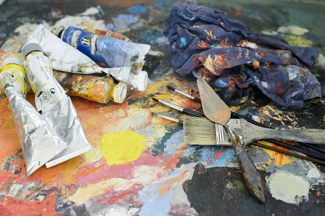 Arts tools such as a paintbrush, canvas, and paints.