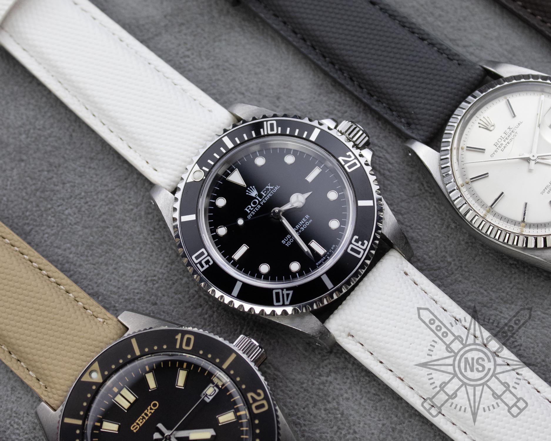 A person cleaning a sailcloth watch strap, showcasing maintenance tips.