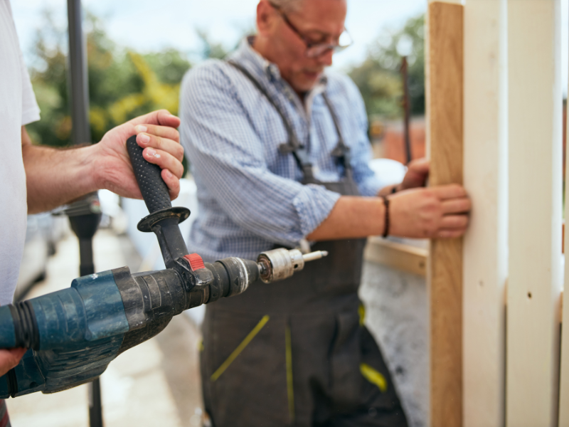 An image showing professional fence installation with tools and materials.